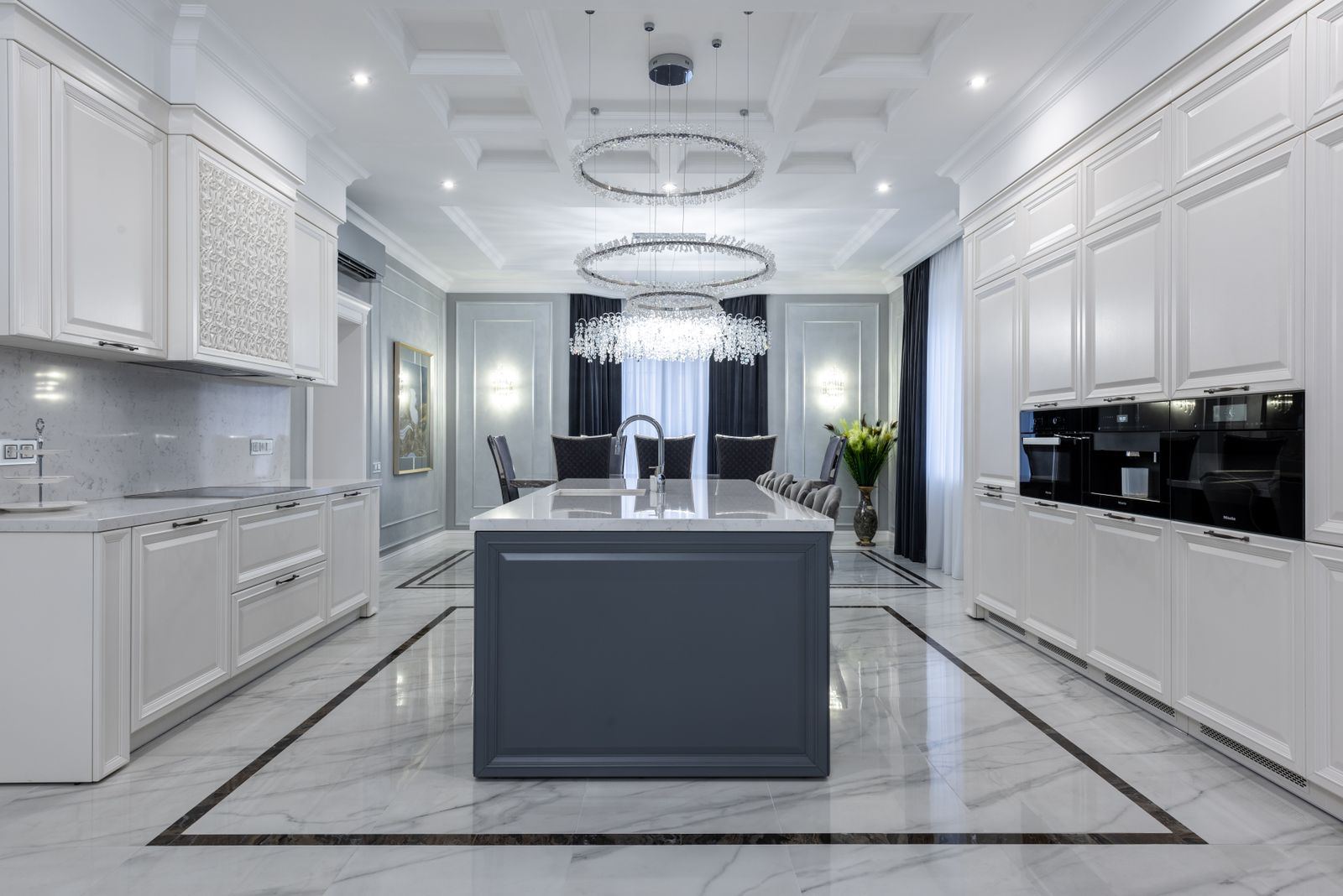 Contemporary Scottsdale kitchen with a stone island and warm pendant lighting